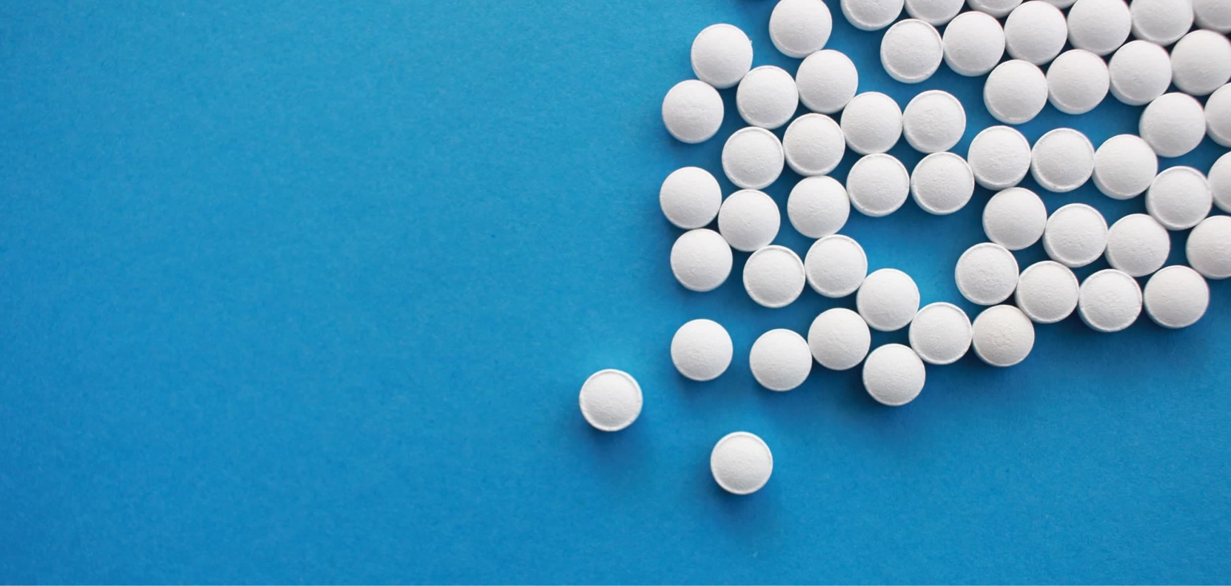 Pills on a blue background